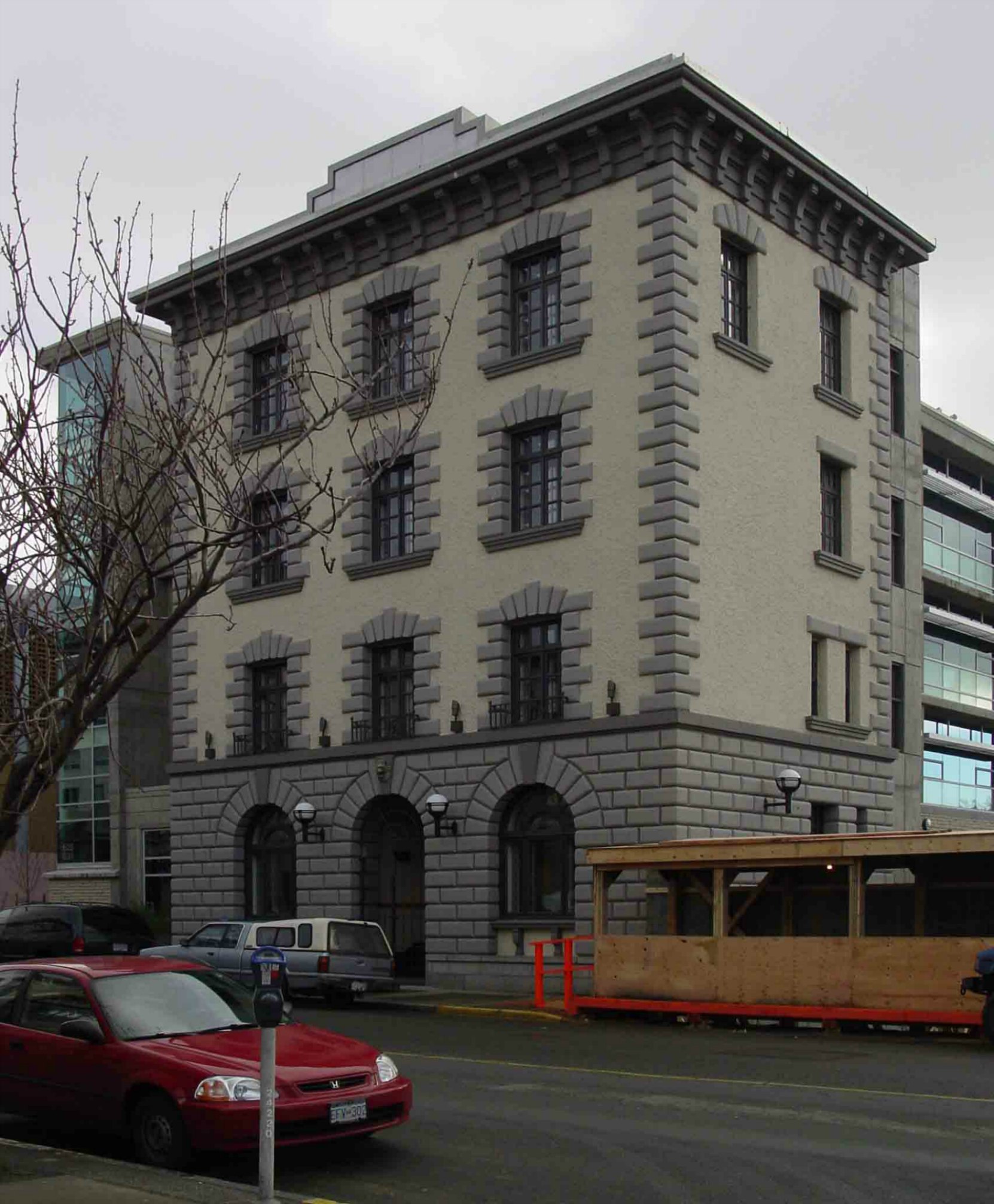 The former Victoria Police headquarters building, 625 Fisgard Street, in 2004 before its facade was incorporated into the C.R.D. building in Centennial Square.