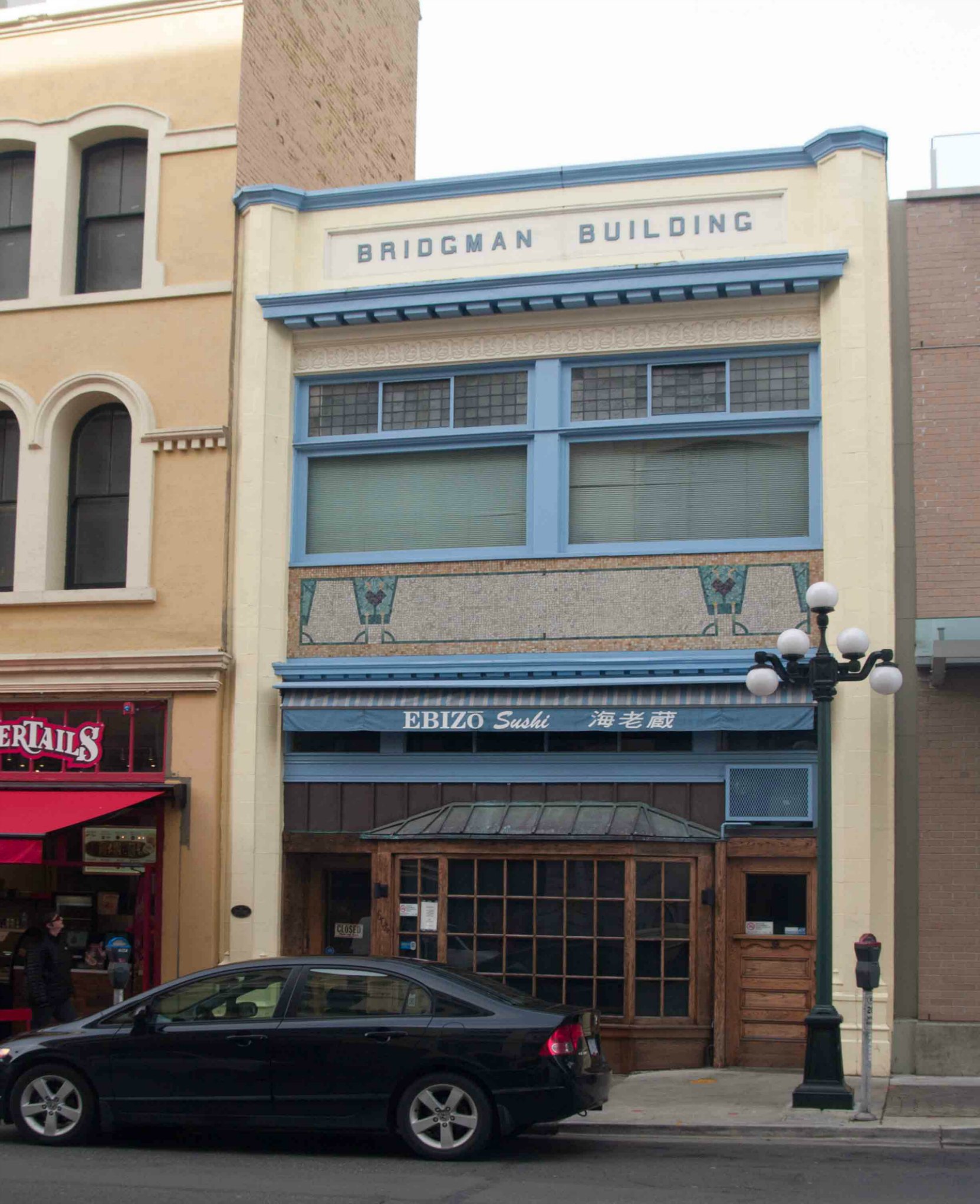 The Bridgman Building at 604 Broughton Street was built in 1885 but its current facade was added in 1910 by architects Percy L. James and Douglas James.