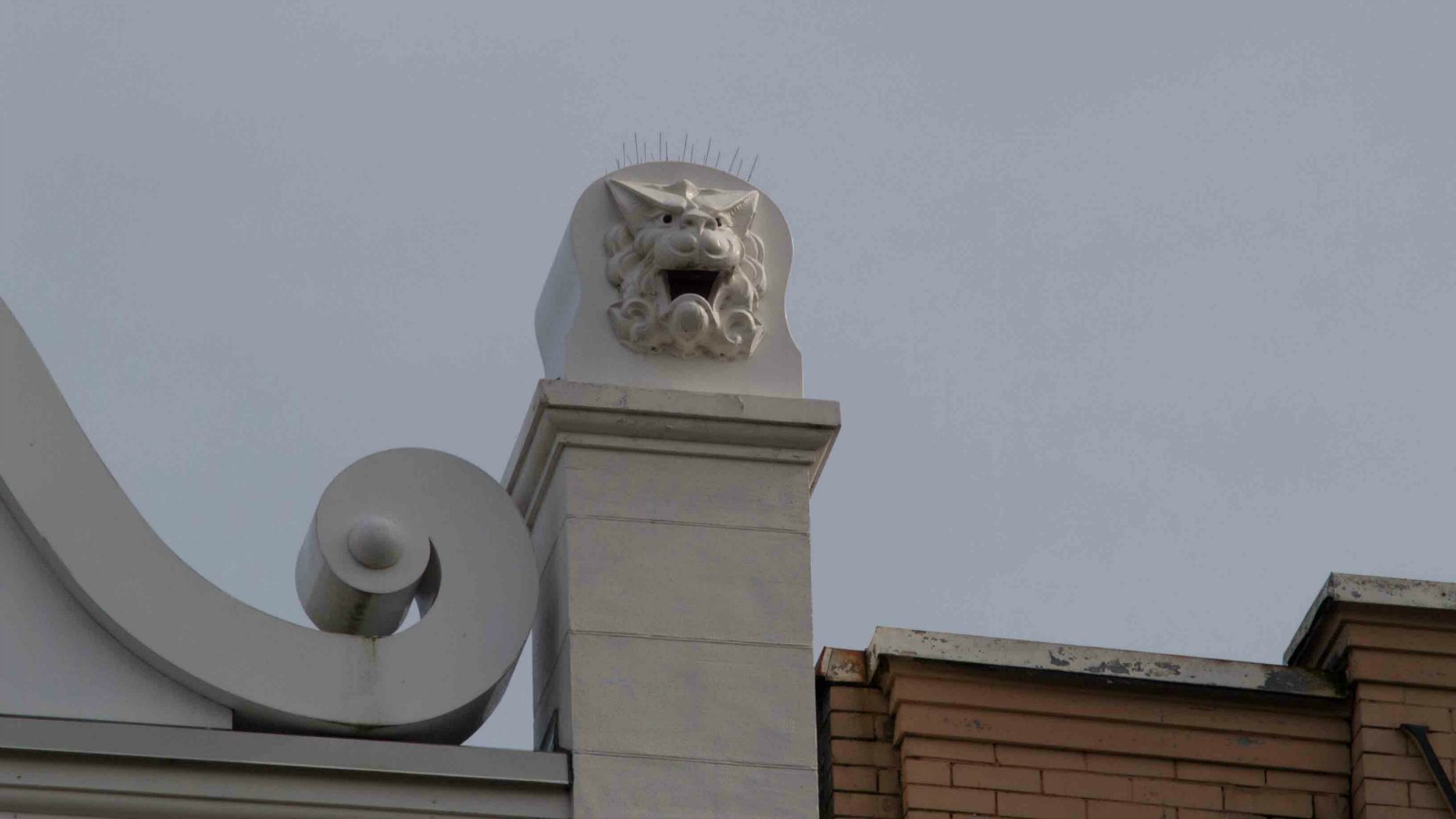Lion head decorative detail on the Chinese Empire Reform Association building at 1715-1717 Government Street.