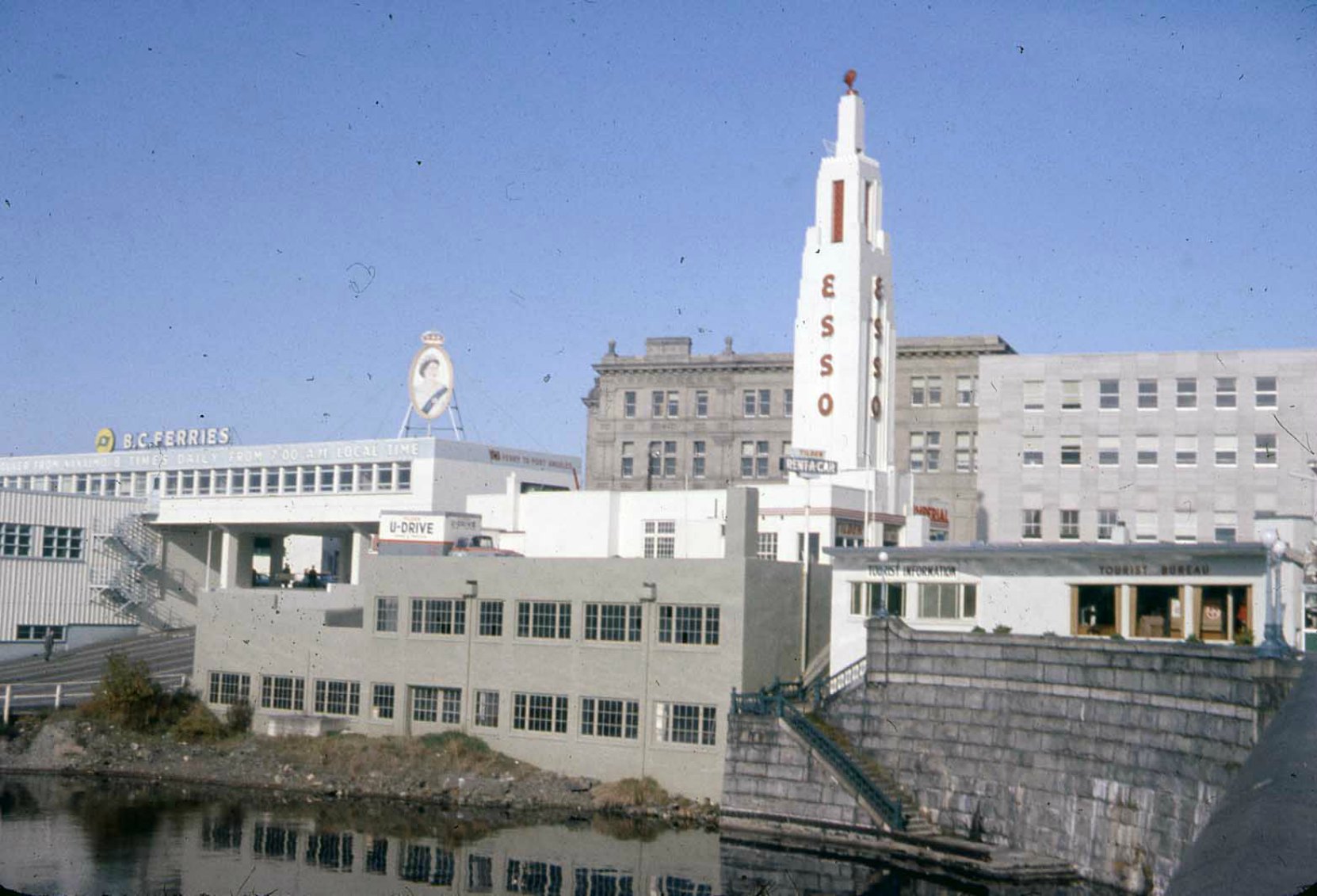 812 Wharf Street as an ESSO station, circa 1960. Note the adjacent BC Ferries terminal. (photo courtesy of Glenbow Museum, used with permission)