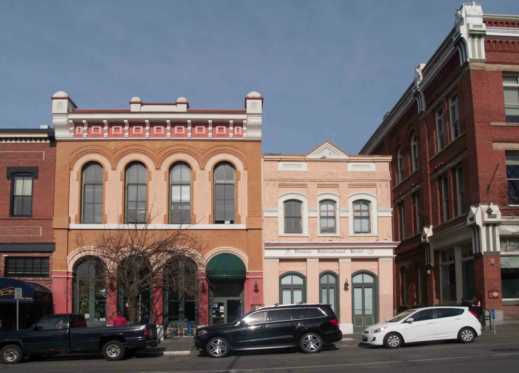 516 Yates Street, built in 1882, and 518 Yates Street, built in 1899. Both buildings are now occupied by Victoria International Hostel.