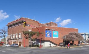 The McPherson Playhouse as seen from Government Street and Pandora Avenue. The original 1914 building is in the background and the 1963 addition is in the foreground.