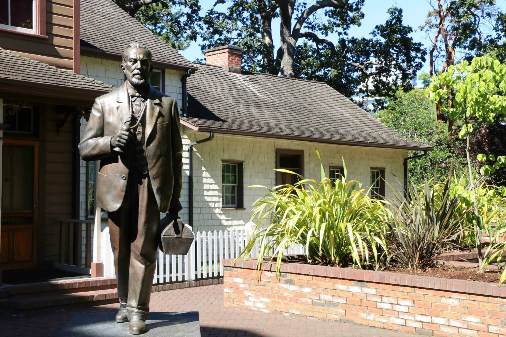 Helmcken House and the statue of Dr. John Sebastian Helmcken, Thunderbird Park