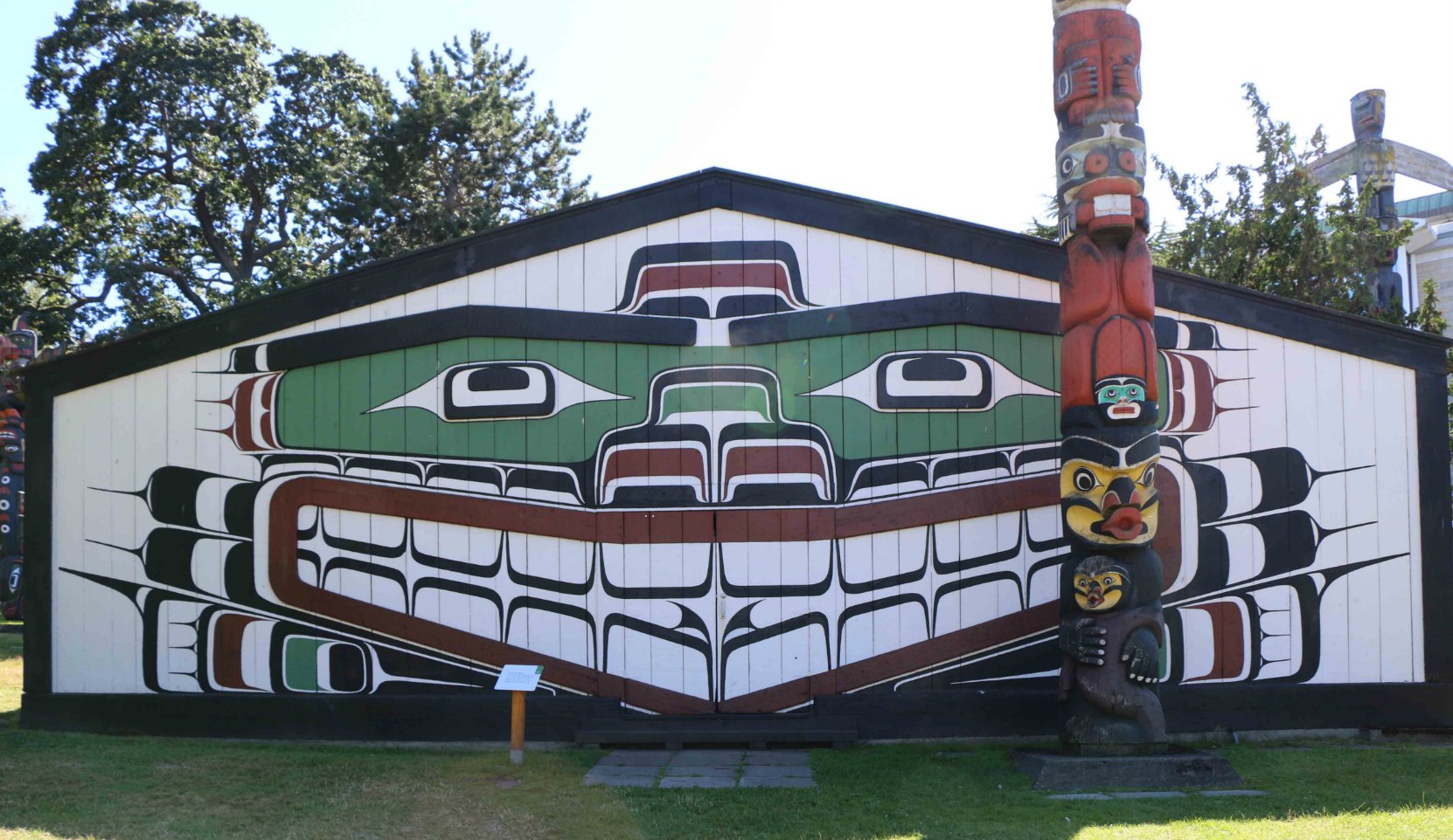 Wawadit'la, also known as Mungo Martin House, was built on this site in 1953. The Kwakwaka'walw Heraldic Pole in front of the building was also carved in 1953.