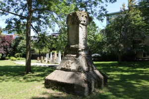 The elements have eroded the inscription on this monument in Pioneer Square to the point that the names on it cannot be read. We are currently trying to confirm who is buried here and we will post that information in the near future (photo by Victoria Online Sightseeing Tours)