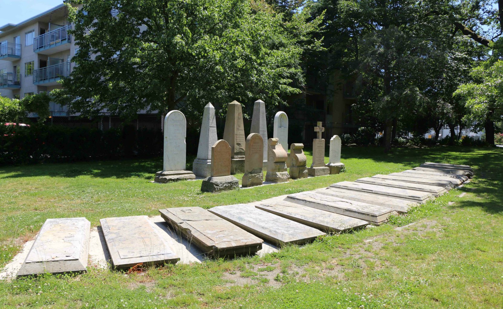 The smaller grave markers remaining in Pioneer Square were moved to the east side of the park. This photo shows how they are currently displayed. (photo by Victoria Online Sightseeing Tours)